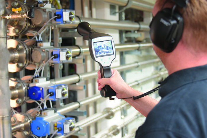 Kaeser Service Technicians using ultrasound measurement technology to detect leaks.